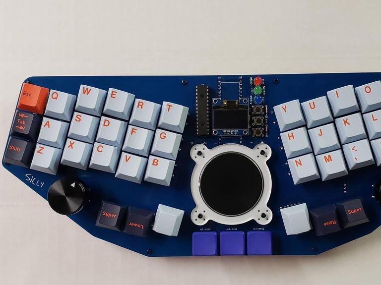 Sugar Glider - 40% Colstag (IC) - Keyboard interest check cover image featuring Sugar Glider, MechWild, Cirque GlidePoint, mechanical keyboard, MX switches, Choc switches, OLED display, touchpad, knobs, PCB, steno support, prototype