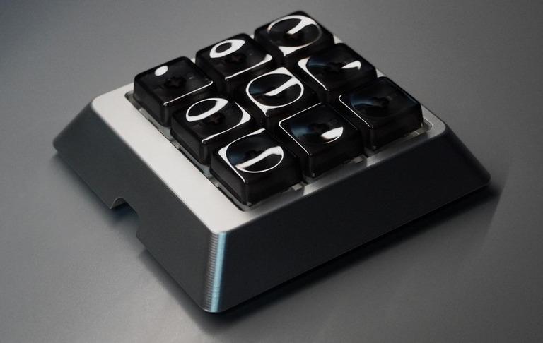 NINER: 9-Key Macro Pad (IC) - Others interest check cover image featuring NINER, macropad, 9 keys, 3x3 layout, hotswap PCB, RGB LED, QMK, VIA, 6063 Aluminum, 304 Stainless Steel, macro functionality
