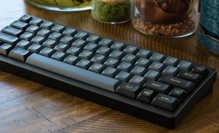 Quartermaster (IC) - Keyboard interest check cover image featuring Quartermaster 60, plateless top mount, mechanical keyboard, 60%, anodized aluminum, brass weight, open source, custom PCB, Design Works Labs