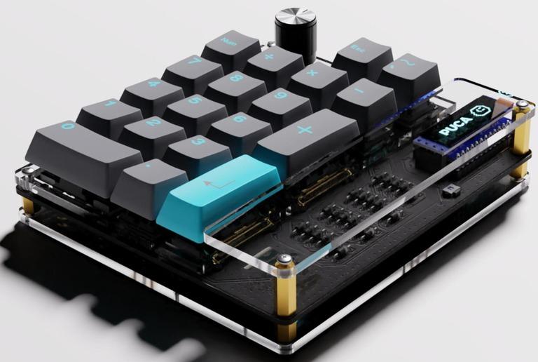 Púca DIY Numpad Kit (IC) - Keyboard interest check cover image featuring Púca, DIY numpad, macropad, exposed components, hot swap sockets, rotary encoder, OLED display, LED underglow, QMK firmware, Vial support, customizable, numpad kit