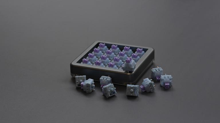 Snow Grape Switch (IC) - Switches interest check cover image featuring Snow Grape Switch, Moyu.studio, linear switch, mechanical keyboard switch, custom switch, POM stem,  Wikuo, pre-lubed switch,  5-pin switch