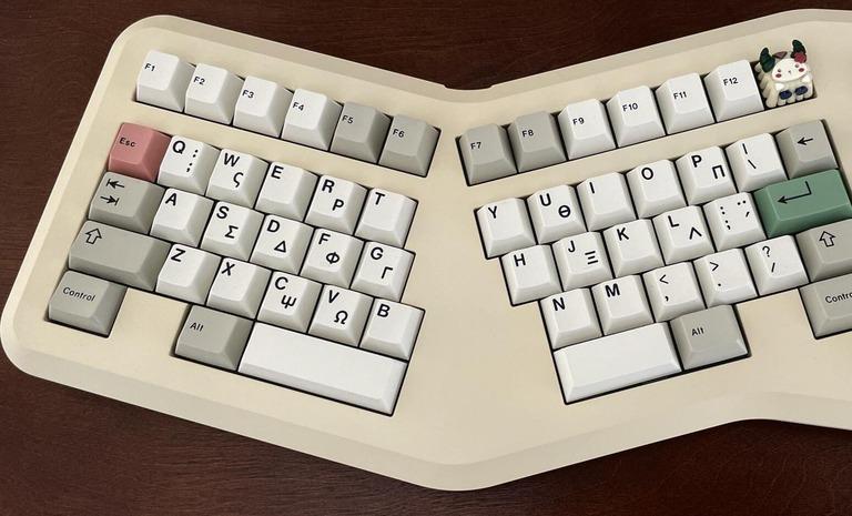 Nearfield (GB) - Keyboard group buy cover image featuring Nearfield, group buy, keyboard, ergonomic design, anodized aluminum, LZ ErGO, QMK, VIAL, ergonomic layout, FR4 plate, cerakoted, Microsoft natural ergonomic, M0110 Apple, Cannon Keys, Deskhero, MyKeyboard.eu, Prototypist, Daily Clack