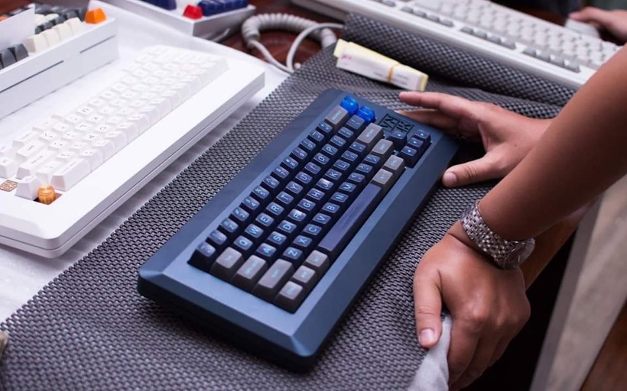 VN66 - Keyboard group buy cover image featuring VN66, mechanical keyboard, VNMK, raffle, Geekhack, Apple M0110, Fibonacci sequence, anodized aluminum, brass, QMK, Carpagon Artisan, wrist rest, Covid-19