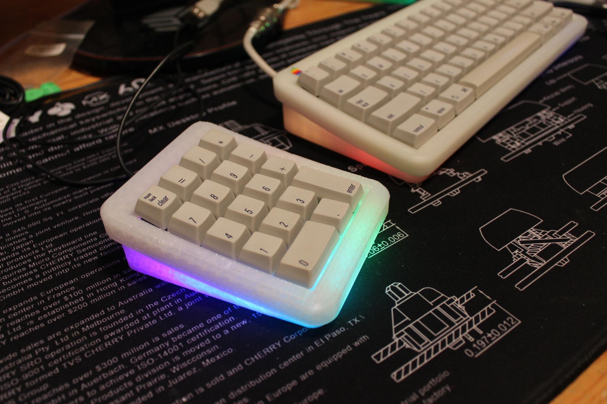 ADK18 Numpad (IC) - Keyboard interest check cover image featuring ADK18, numpad, 3D printed, PCB, ADK64, QMK, USB-C, RGB, Alps, MX