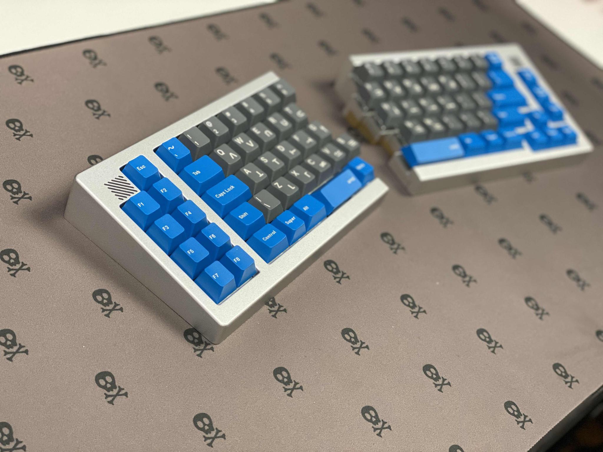 Doppelgänger (IC) - Keyboard interest check cover image featuring keyboard, split, 65%, macro pad, ergo, topclack, build stream, pc, microsoft, QMK firmware, USB-C, prototype, group buy, revisions, design