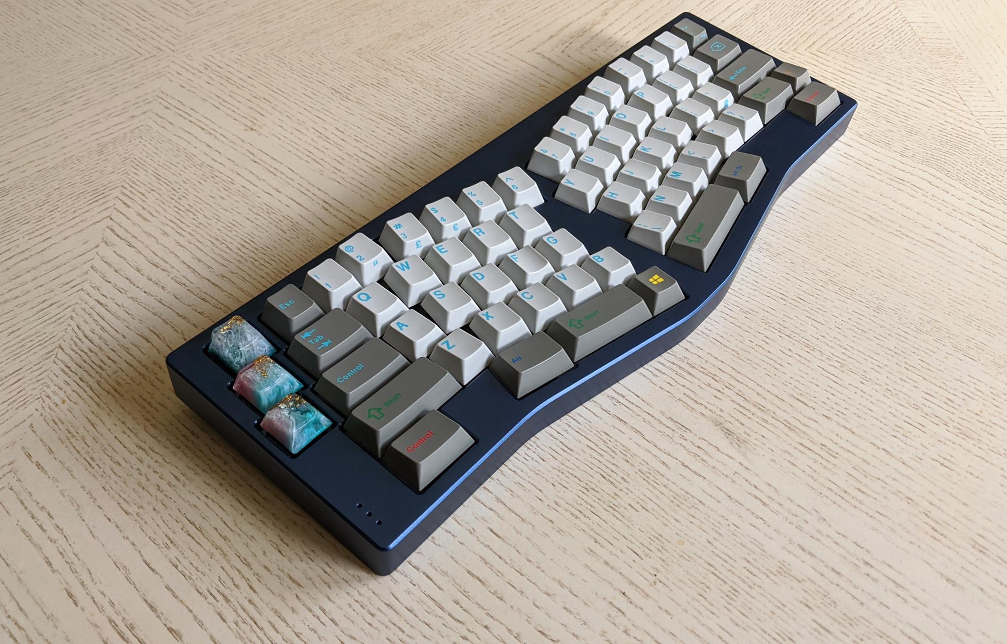 Fallacy (IC) - Keyboard interest check cover image featuring Fallacy, Alice clones, keyboard group buy, anodized aluminum, brass weight, typing angle, PCB QMK, Trifelife