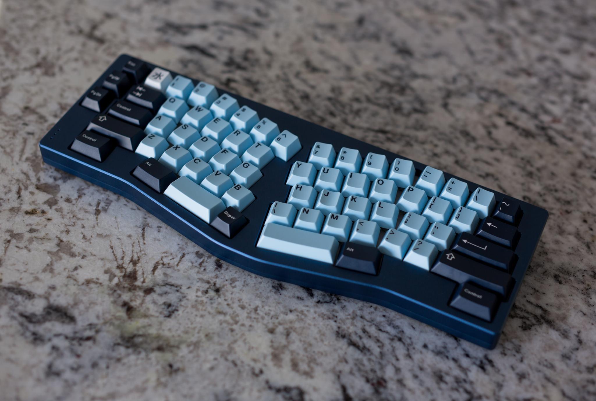 Fallacy - Uncategorized group buy cover image featuring Fallacy, group buy, keyboard, PCB, brass plate, anodized aluminum, customization, QMK compatibility, Alice layout
