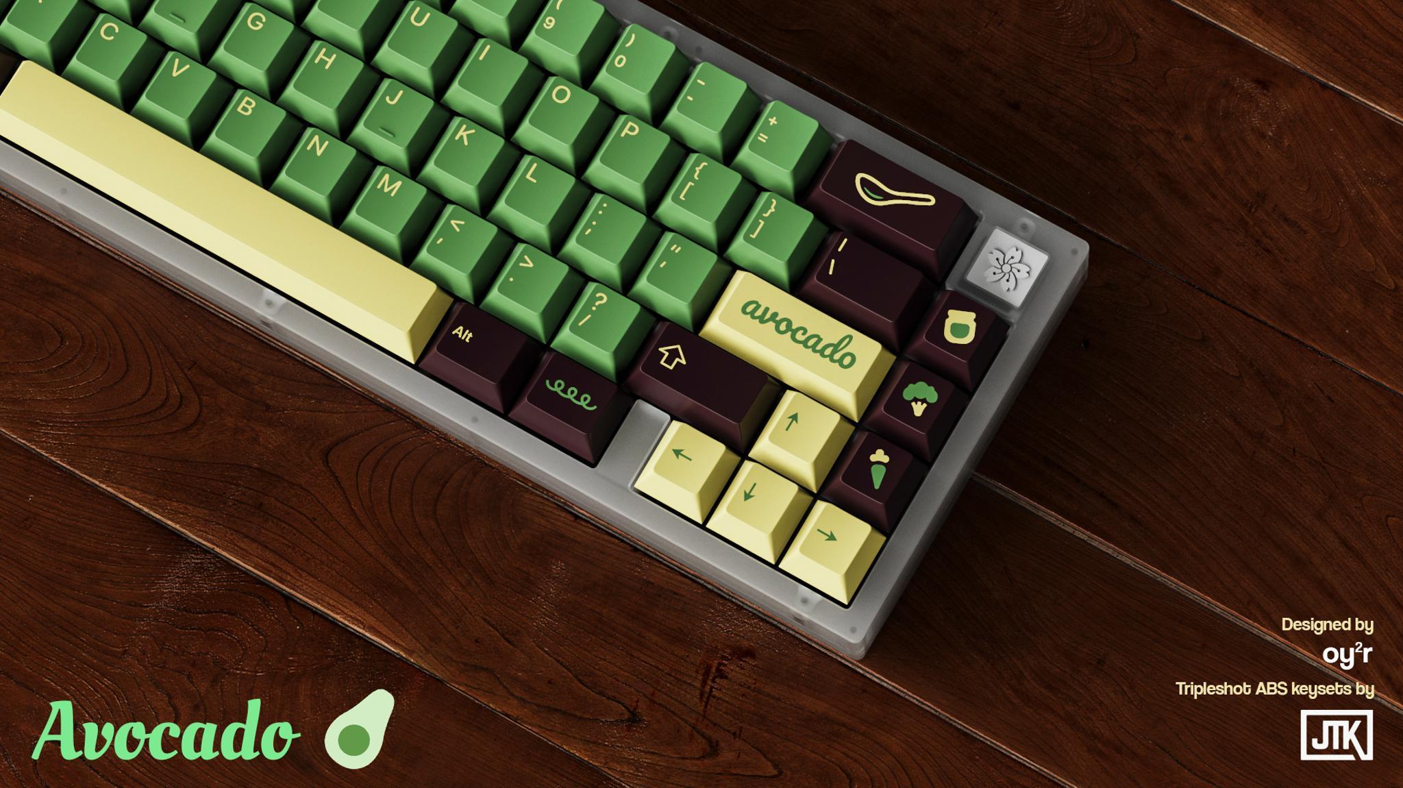JTK Avocado (IC) - Keycap interest check cover image featuring JTK Avocado, avocado design, keyboard keyset, green alphas kit, yellow alphas kit, modifiers kit, spacebars kit, deskmat design, Pantone colors, JTK manufacturer