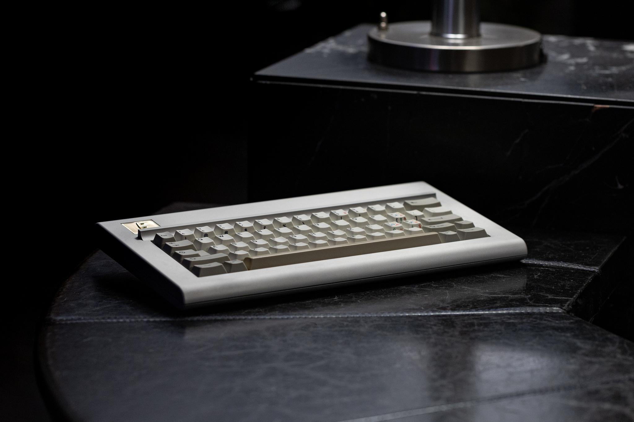 Modern F (IC) - Keyboard interest check cover image featuring Modern F, IBM Model F, 60% keyboard, Kazoos & Co, 6063 aluminum, C260 Brass, ANSI, ISO, TSANGAN, 10u spacebars, DZ60 compatibility, 3D printed case, powder coat, Clear Anodizing, PCB