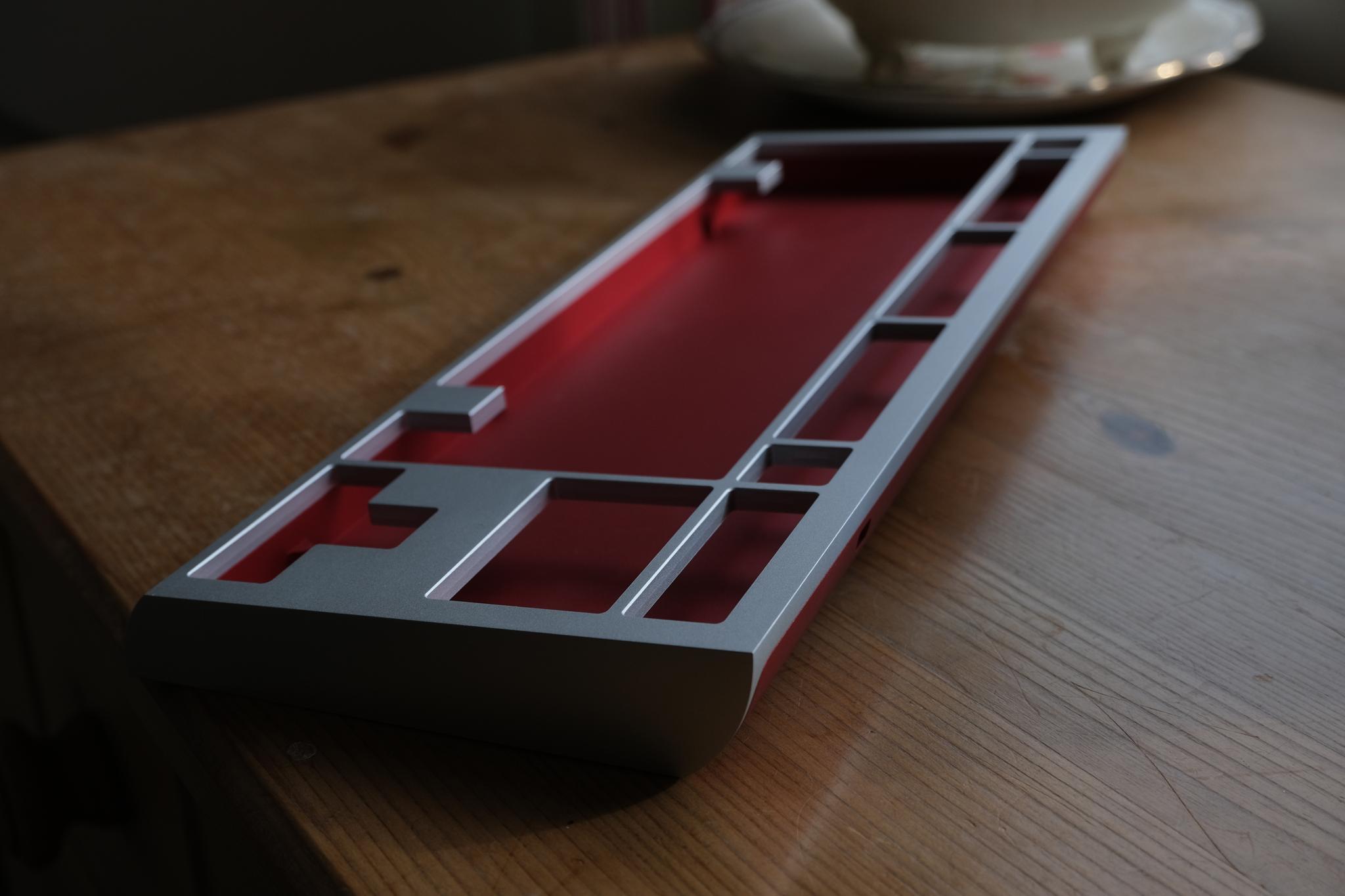 Ex Arkhe (IC) - Keyboard interest check cover image featuring Ex Arkhe, keyboard design, TKL, rowing shell, katamaran, WKL, typing angle, aluminium case, GB thread, typing test