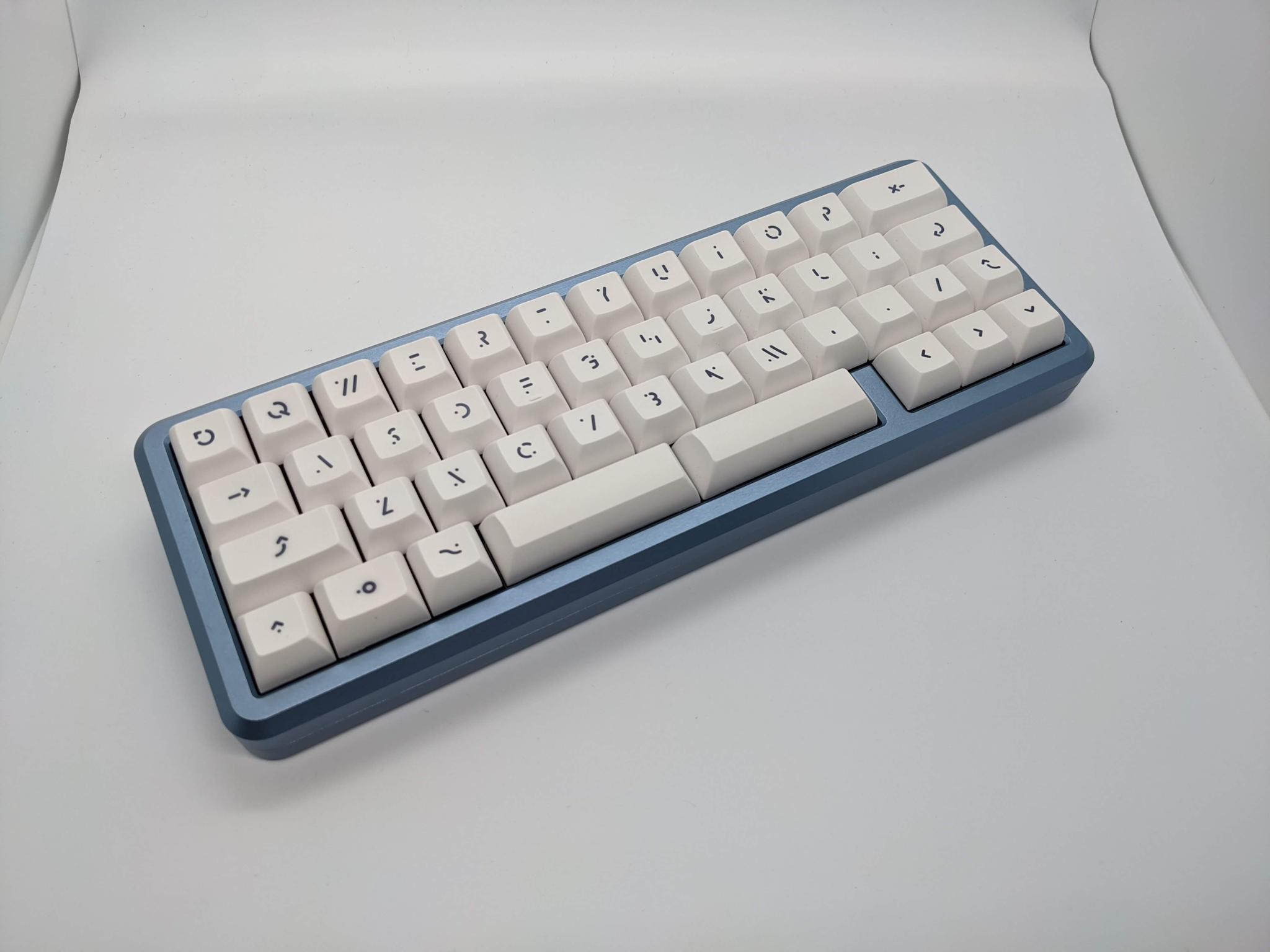 MB-44 (IC) - Keyboard interest check cover image featuring MB-44, keyboard, Minivan layout, 65%-esque, typing angle, encoder support, Atmega32u2, Unified C3, QMK, group buy, custom keyboard, typing test, dededecline