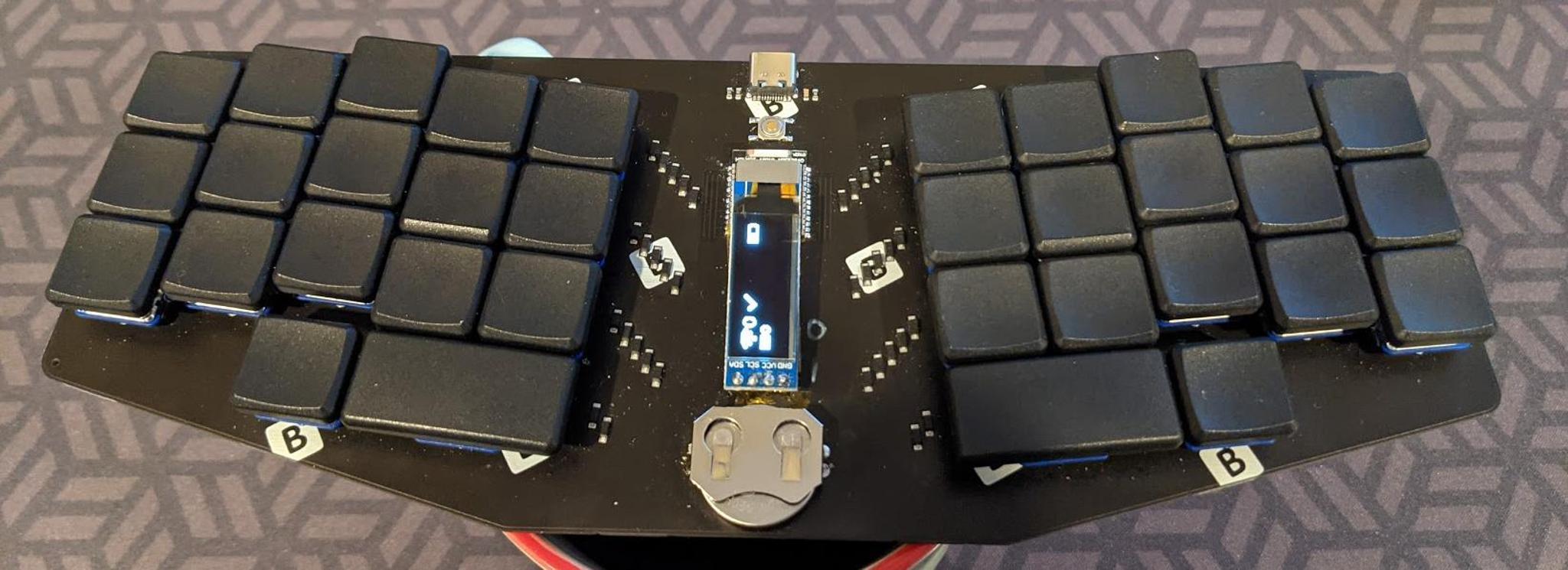 BLe Chiffre (IC) - Keyboard interest check cover image featuring BLe Chiffre, wireless keyboard, ZMK firmware, choc spacing, nrf52 module, rechargeable battery, OLED support