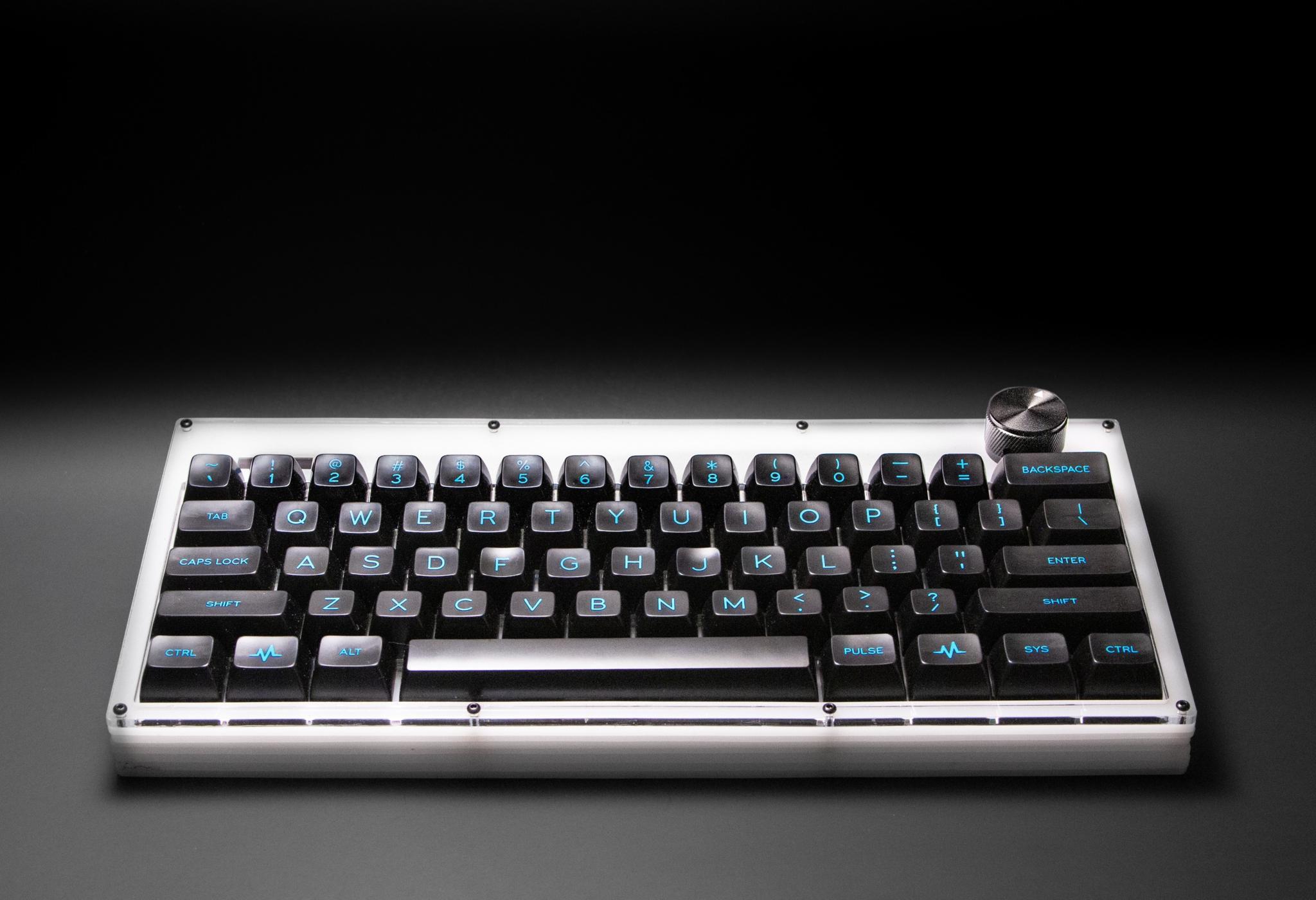 Grabert 60% (IC) - Keyboard interest check cover image featuring Grabert, 60% keyboard, OLED screen, rotary knob, open source, customizable, FreeCAD, KiCAD, QMK, Keyberon, microcontroller