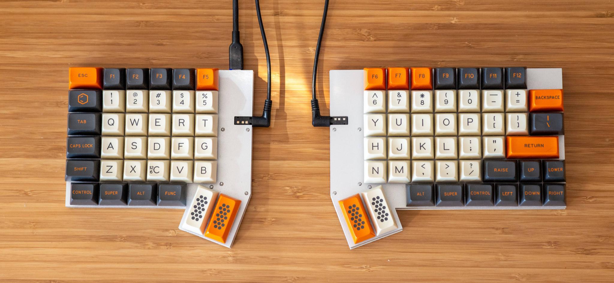 Orthograph (IC) - Keyboard interest check cover image featuring orthograph, split keyboard, ortho layout, hot-swap sockets, RGB lighting, gaming keyboard, Ergodox alternative, mechanical keyboard