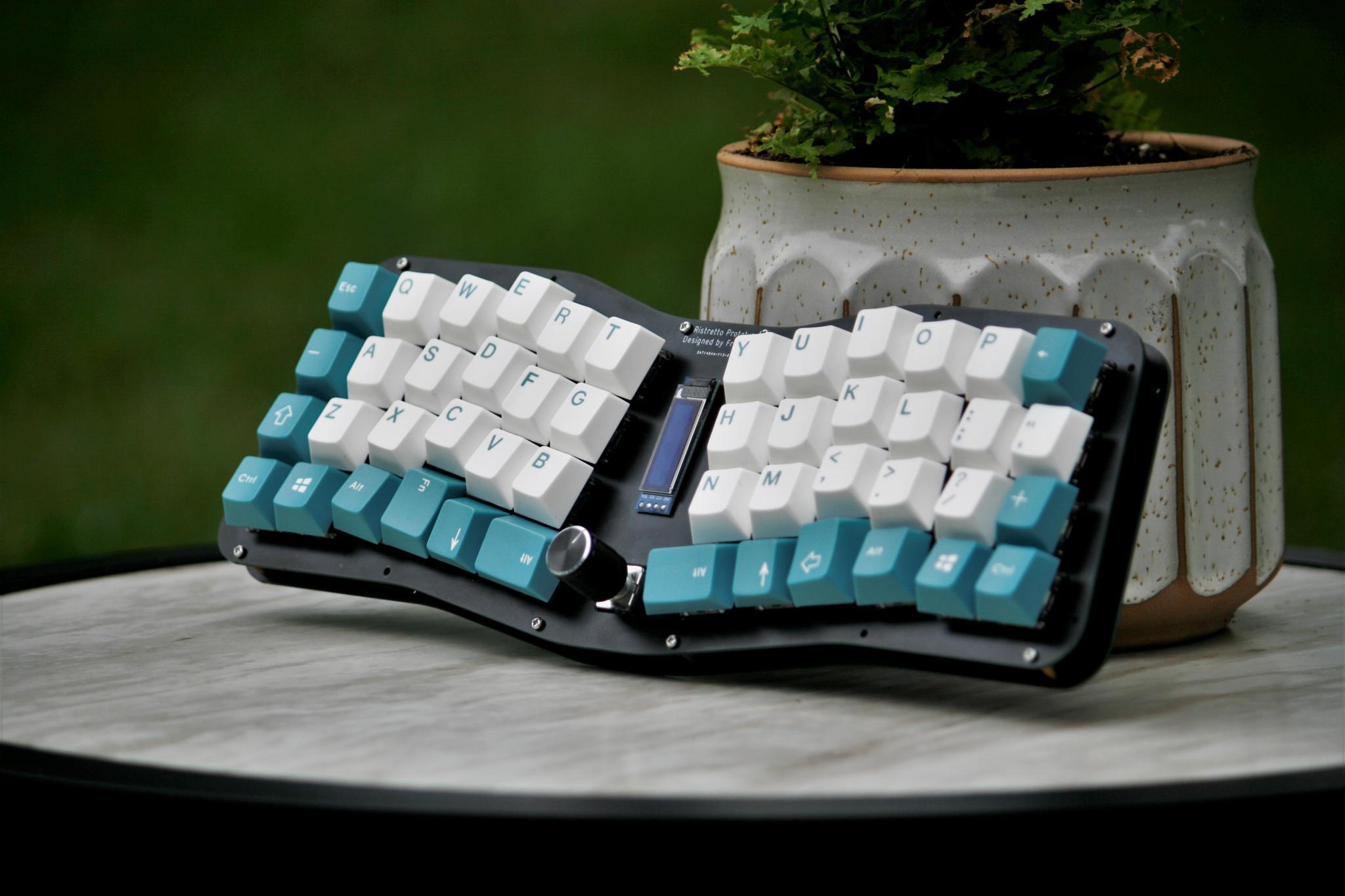 Ristretto (IC) - Keyboard interest check cover image featuring Ristretto keyboard, integrated column stagger, 40% keyboard, OLED support, rotary encoder, ergonomic typing, FR4 kit, acrylic case, POM, PETG plate