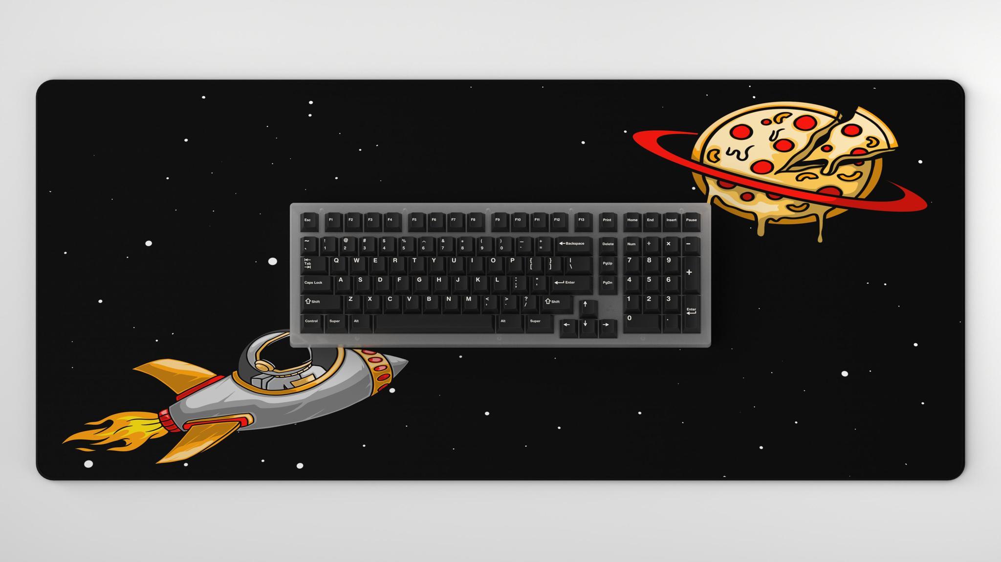 Space À la carte Deskmat (IC) - Deskmats & Accessories interest check cover image featuring deskmat, space, keyboards, design, pizza, hobby, journey, interest check