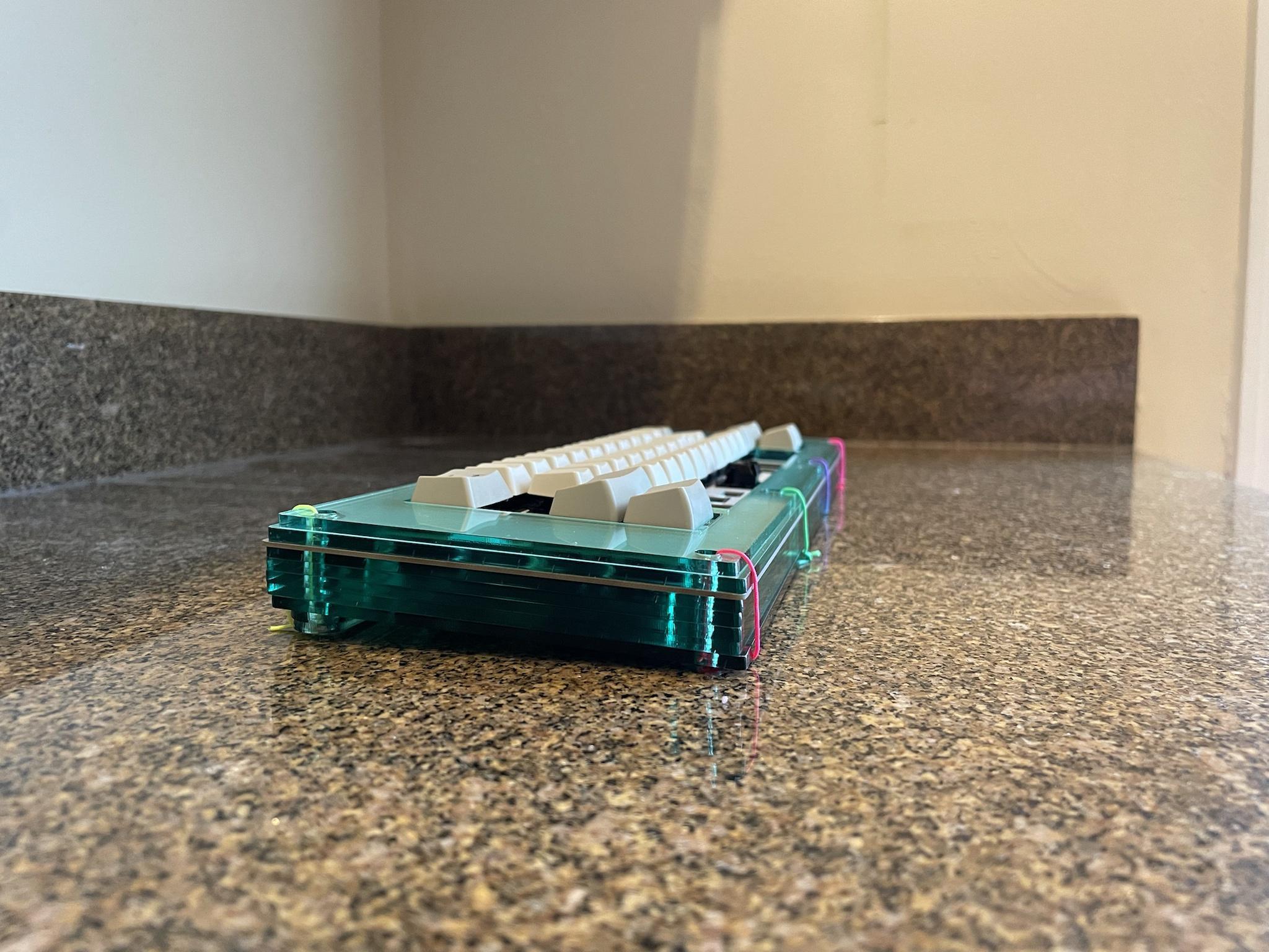 SI40 (IC) - Keyboard interest check cover image featuring SI40, 40% keyboard, Space Invader, Hi-Tek Series 725, acrylic keyboard, stacked acrylic case, PCB design, Atmega32u2, QMK, VIA, VIAL, stabilizers, prototype, laser cutting