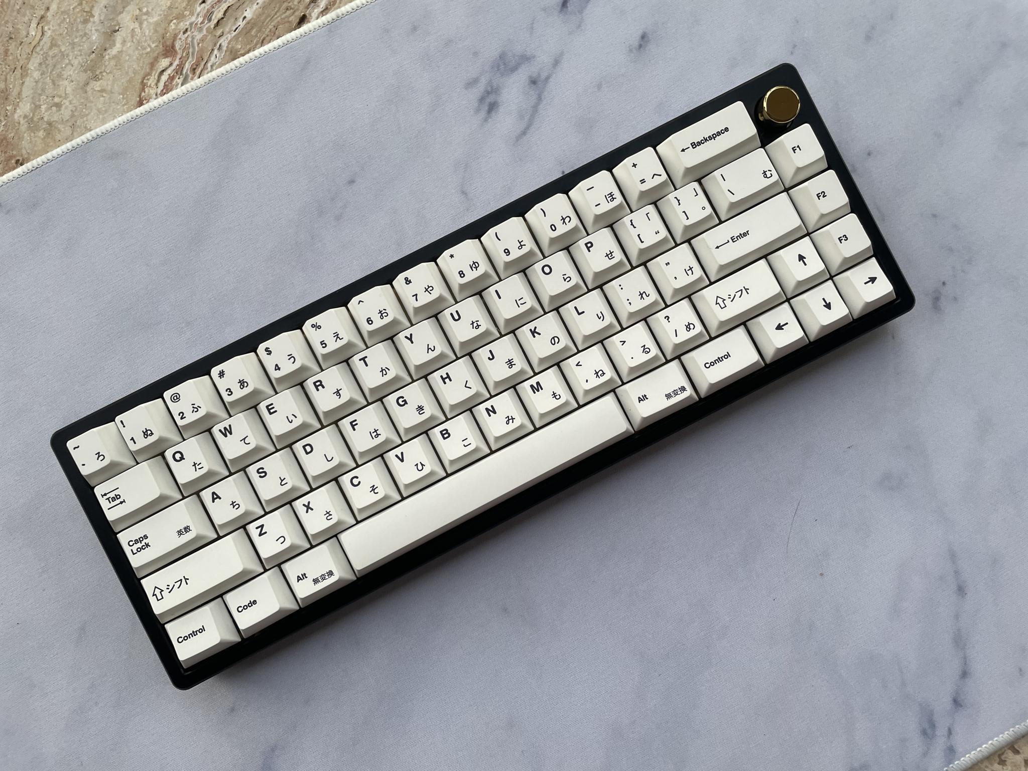 Gentleman 65 Suited Edition (IC) - Keyboard interest check cover image featuring Gentleman 65, Suited Edition, custom keyboard, high-quality keyboard, burger top mount, plateless mounting, Bead Blasted Polycarbonate, Black Aluminum, E-white Aluminum, Mint Aluminum, brass weight, knob, sound profile, PCB backings, customization, keyboard aesthetics
