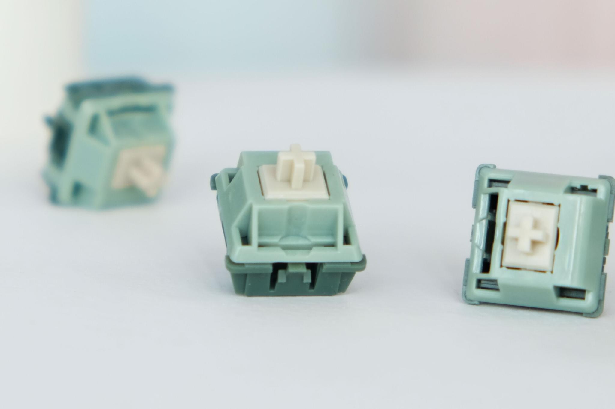 Green Snake Switch (IC) - Switch interest check cover image featuring green snake switch, Suixin studio, Moyu.studio, linear switch, JWK, keyboard switch, POM stem, PC housing, PA housing, mechanical keyboard, interest check