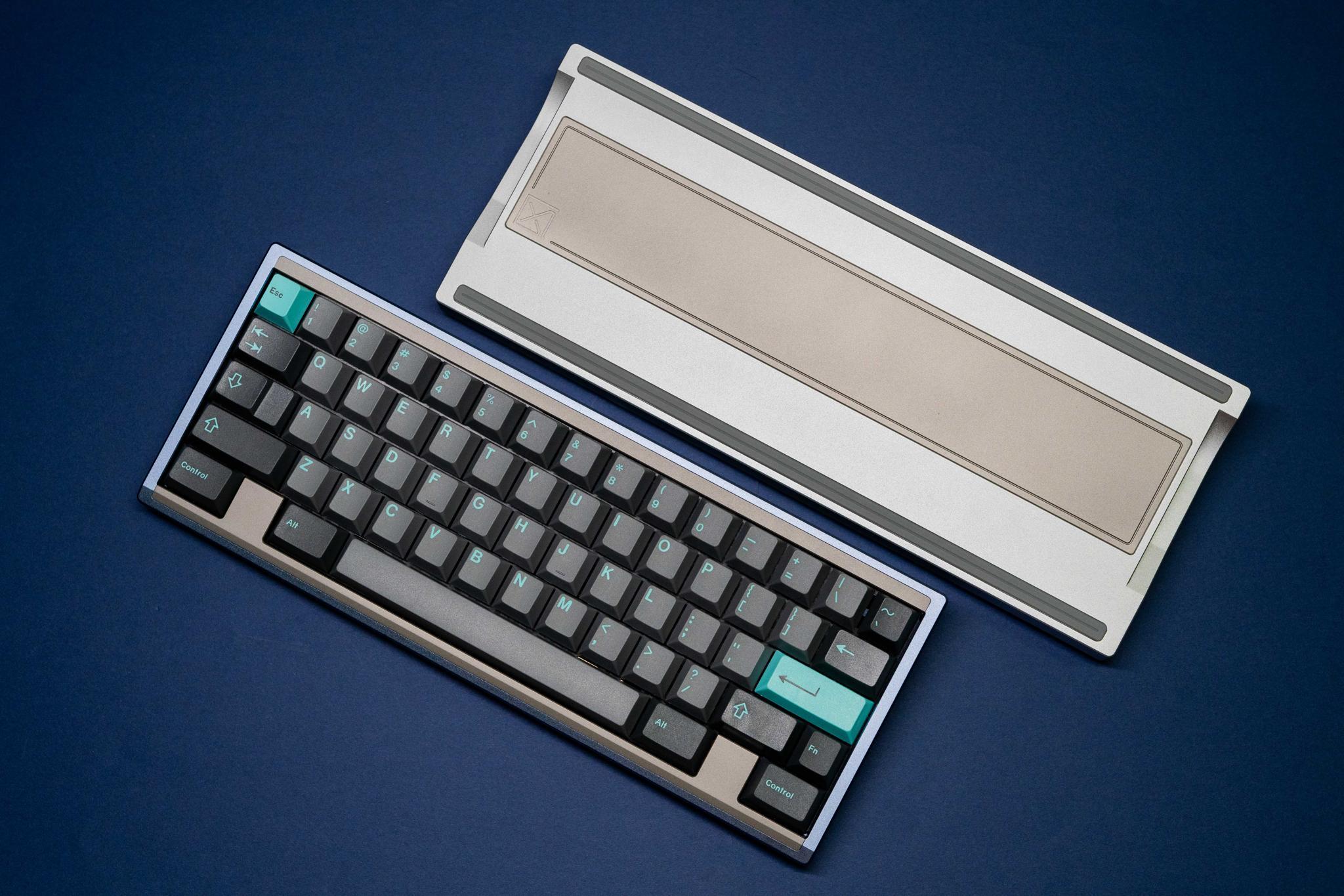 Typ 60 (IC) - Keyboard interest check cover image featuring Typ 60, Axiom Studios, in-stock sale, mechanical keyboard, interchangeable blockers, Angelite Blue, Titanium Silver, 60% keyboard, stainless steel, o-ring mount, GMK Mictlán, Kneedeep Patina, raffle, Kopibeng, carbon fiber plate