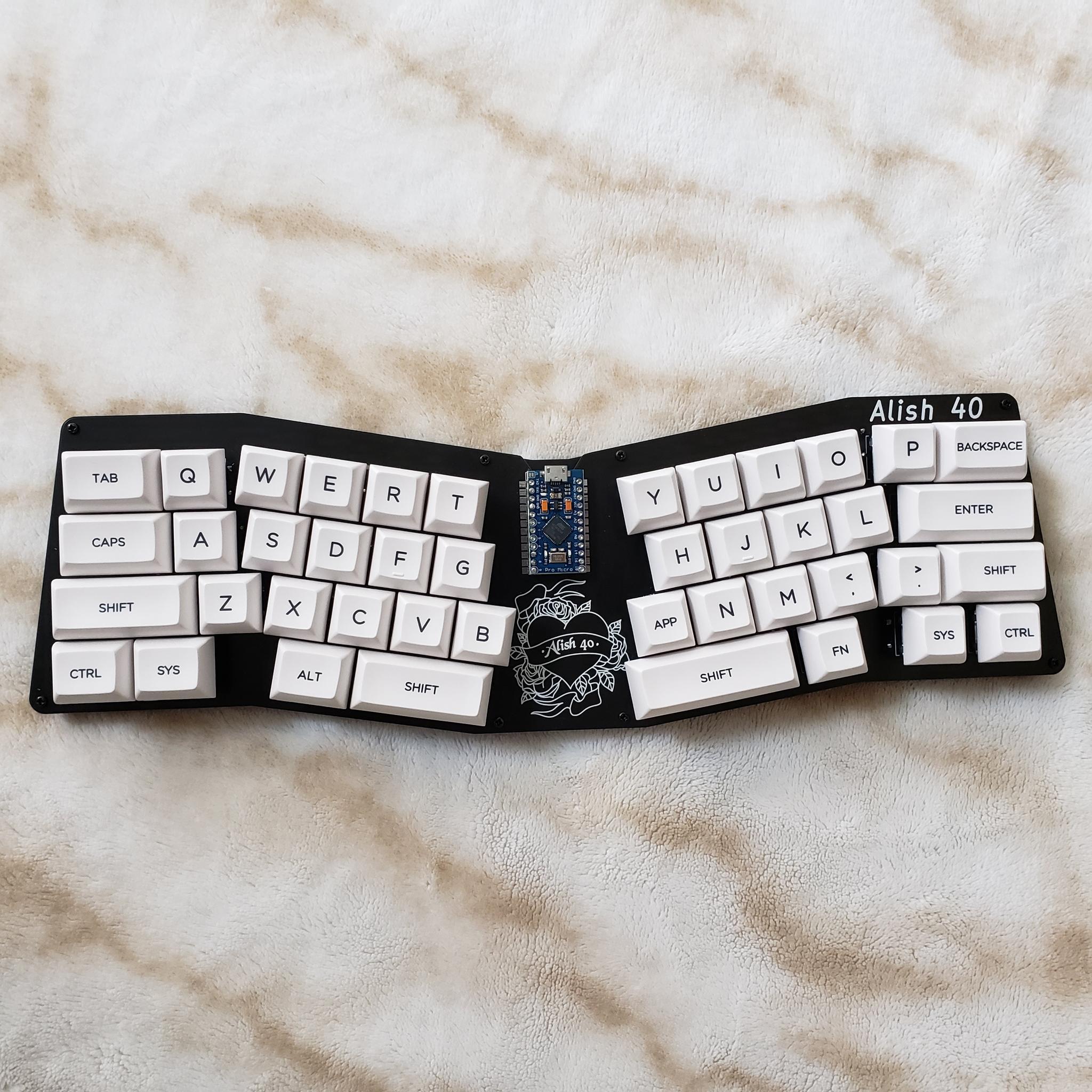 Alish 40 (IC) - Keyboard interest check cover image featuring Alish 40, unibody split Alice, PCB kit, through hole kits, 40% keyboard, affordable keyboard, Pro-Micro, RP2040, QMK, KMK, keyboard enthusiasts